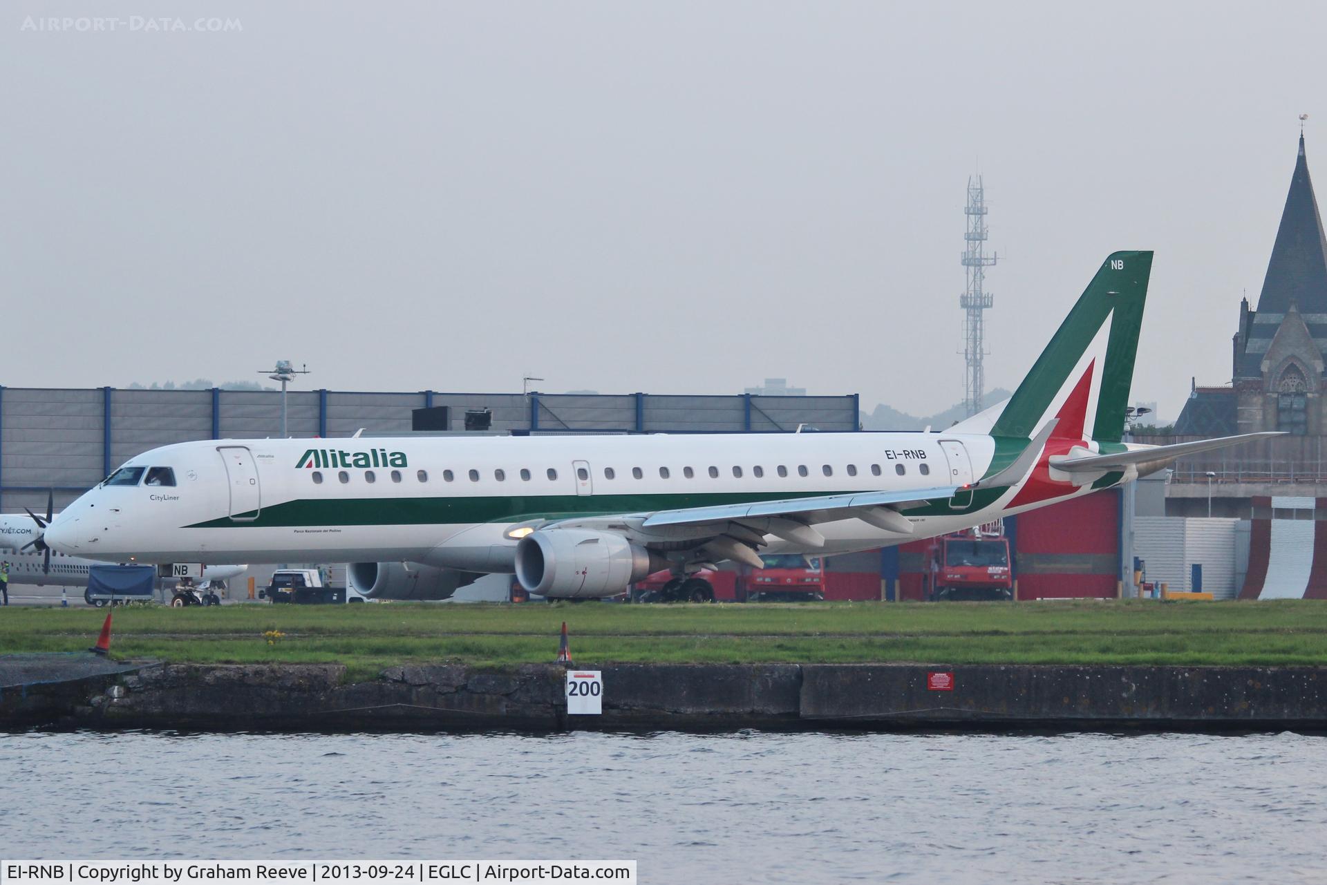 EI-RNB, 2011 Embraer 190LR (ERJ-190-100LR) C/N 19000479, About to depart in the early evening twilight.