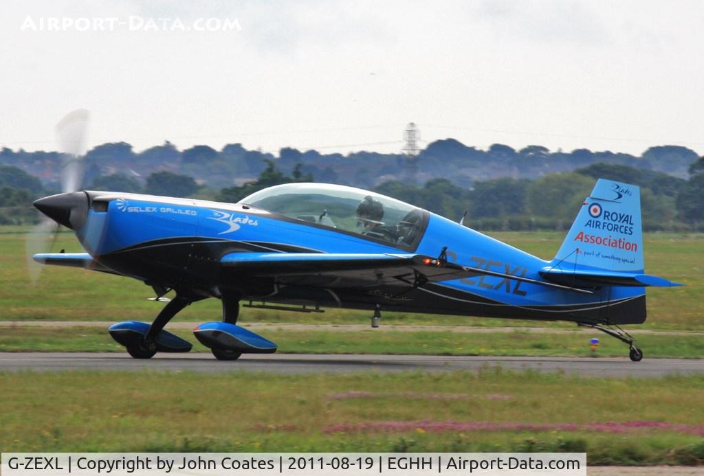 G-ZEXL, 2006 Extra EA-300L C/N 1225, Off to perform at the seafront