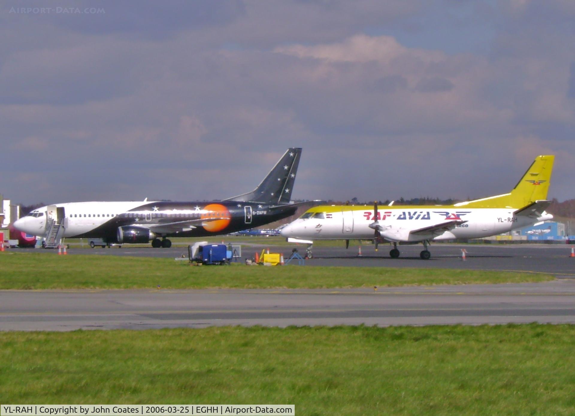 YL-RAH, 1986 Saab 340A(F) C/N 340A-081, On cargo apron with G-ZAPW