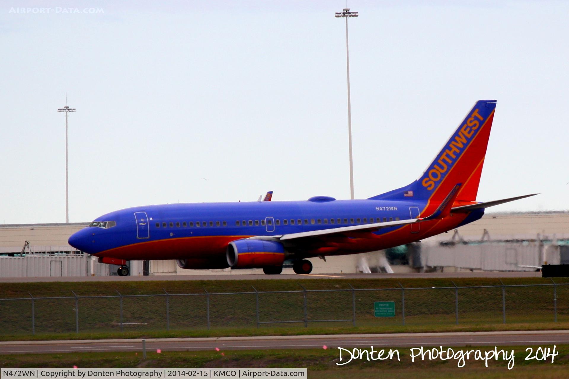 N472WN, 2004 Boeing 737-7H4 C/N 33831, Southwest Flight 2219 (N472WN) taxis at Orlando International Airport prior to a flight to General Mitchell Airport