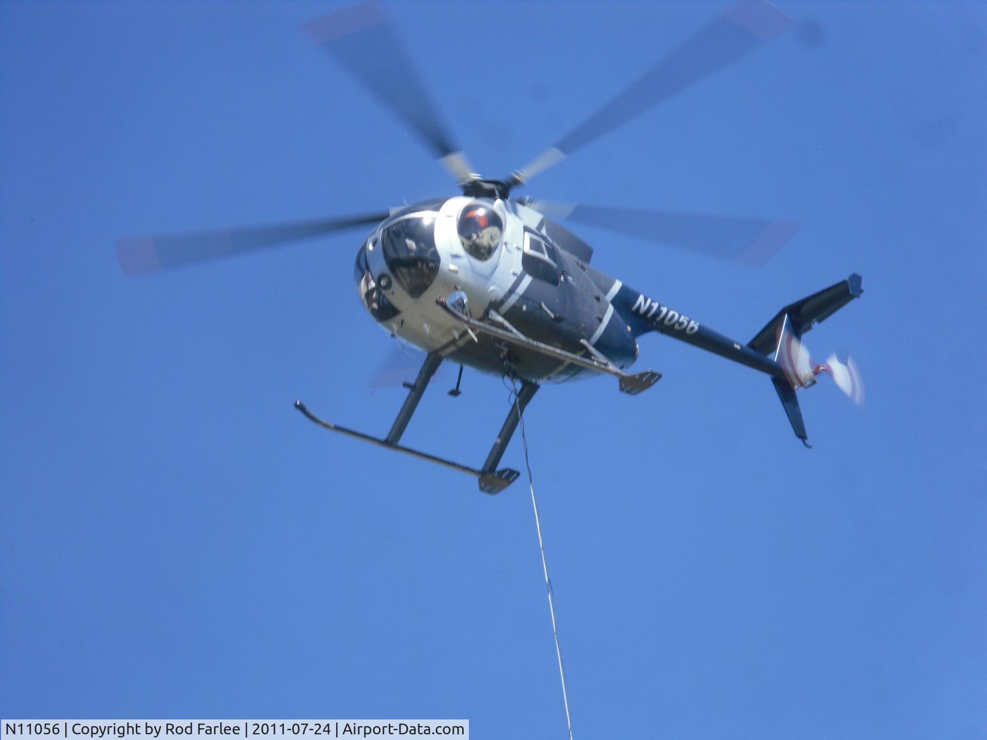 N11056, 1981 Hughes 369D C/N 310905D, Lifting sling load of search & rescue supplies, Olympic National Park, flight from Blue Mountain to Low Divide Ranger Station, July 2011