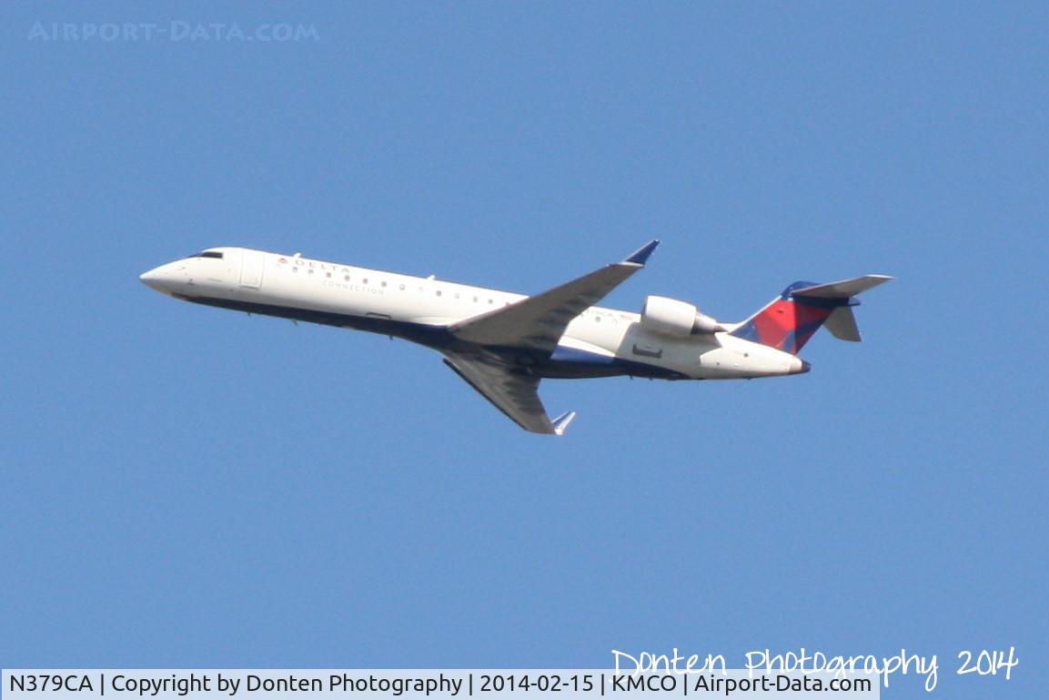 N379CA, 2003 Bombardier CRJ-701ER (CL-600-2C10) Regional Jet C/N 10102, Delta Flight 6189 operated by GoJet (N379CA) departs Orlando International Airport enroute to Nashville International Airport