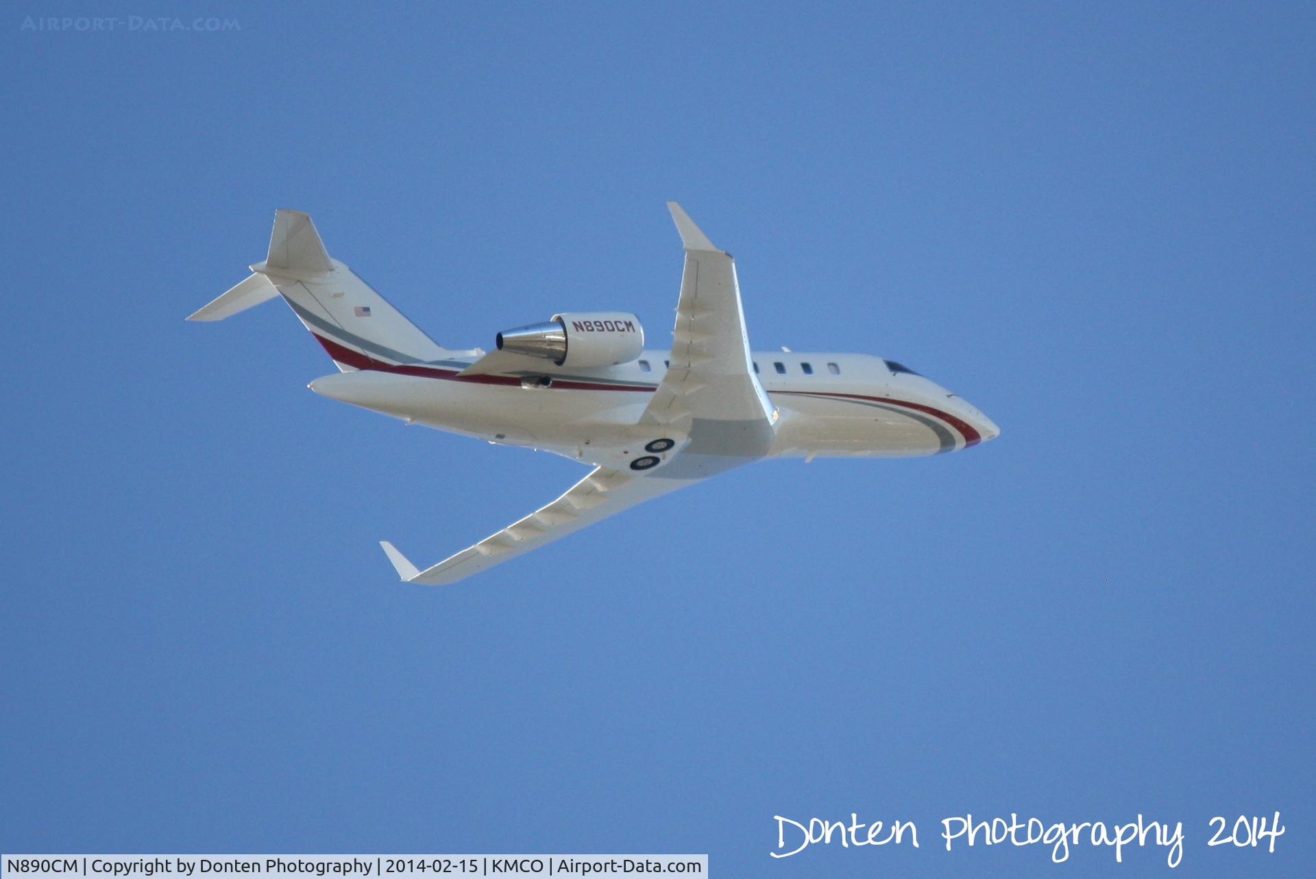 N890CM, 2010 Bombardier Challenger 605 (CL-600-2B16) C/N 5862, Bombardier Challenger 600 (N890CM) departs Orlando International Airport