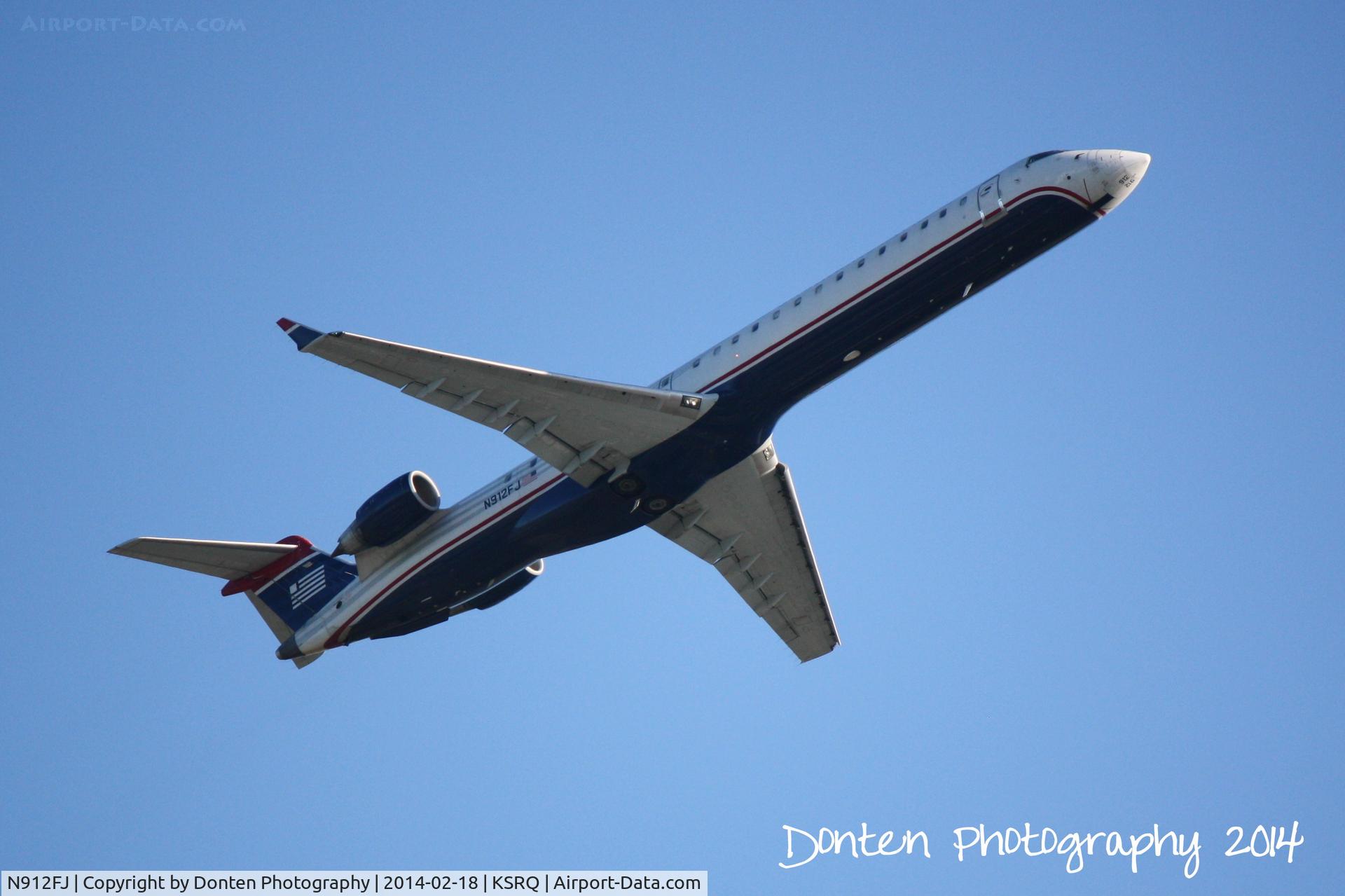 N912FJ, 2004 Bombardier CRJ-900ER (CL-600-2D24) C/N 15012, US Air Flight 2749 operated by Mesa (N912FJ) departs Sarasota-Bradenton International Airport enroute to Charlotte-Douglas International Airport