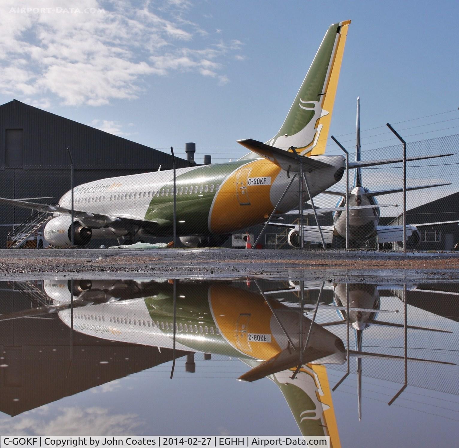 C-GOKF, 1999 Boeing 737-36N C/N 28596, Sat reflecting