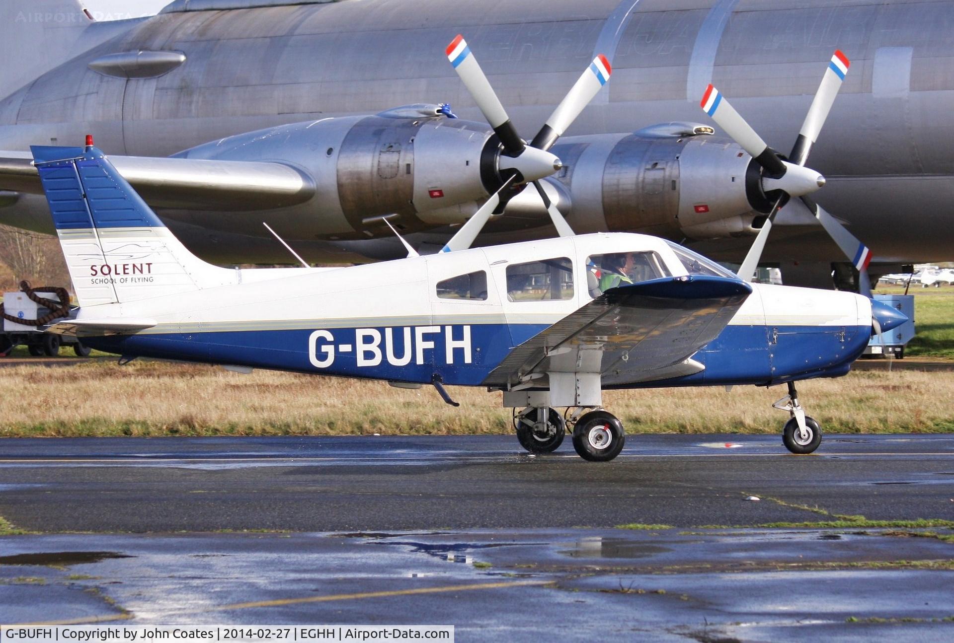G-BUFH, 1984 Piper PA-28-161 Warrior II C/N 28-8416076, CL44 makes great backdrop