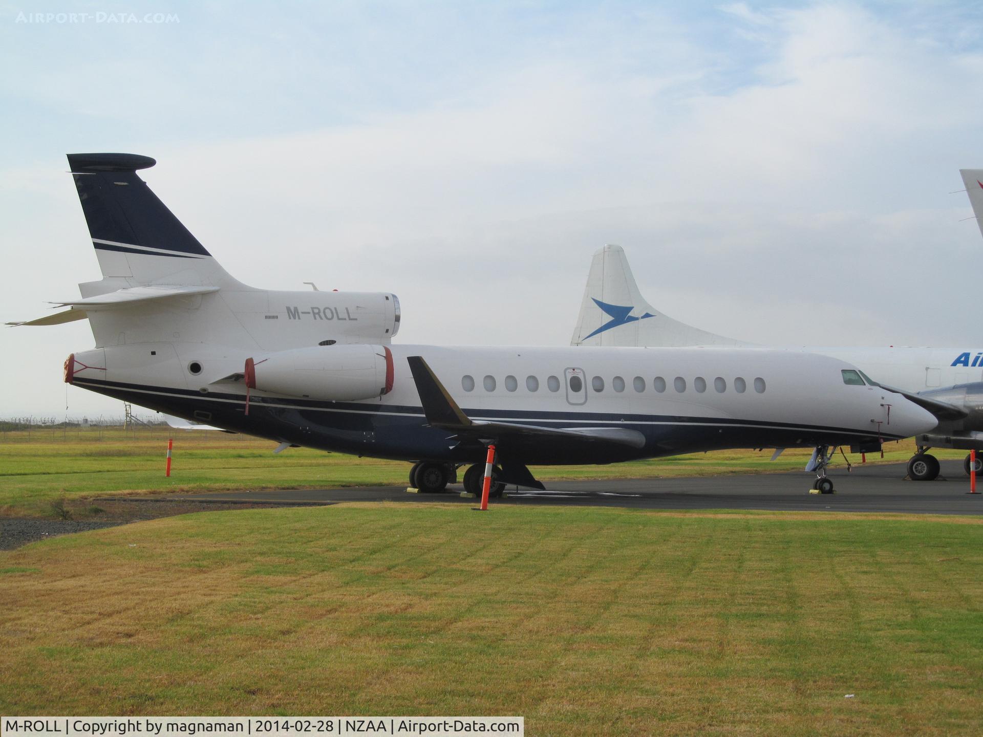 M-ROLL, 2008 Dassault Falcon 7X C/N 040, Having not seen one of these falcon 7X until last year - now seen about 6 in less than 2 months. This one in via a few days stop in Tahiti.
