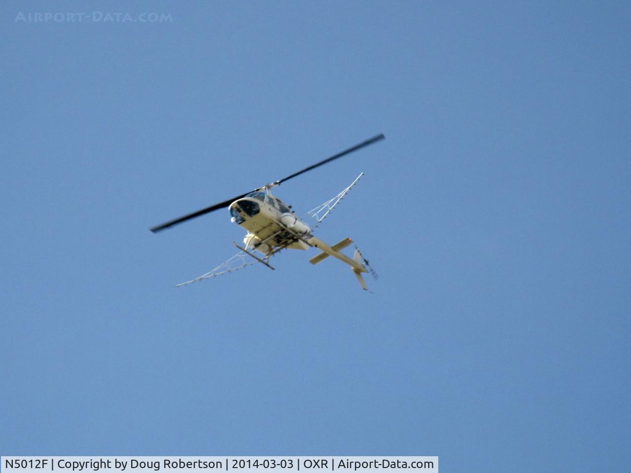 N5012F, 1978 Bell 206B-3 JetRanger III, C/N 2559, 1978 Bell 206B-3 JetRanger III, one Allison 250-C20B turboshaft 420 shp, of Aspen Helicopters based OXR, max takeoff external load 3,350 lbs, departure from OXR for crop-dusting job. Note tanks & spray booms.
