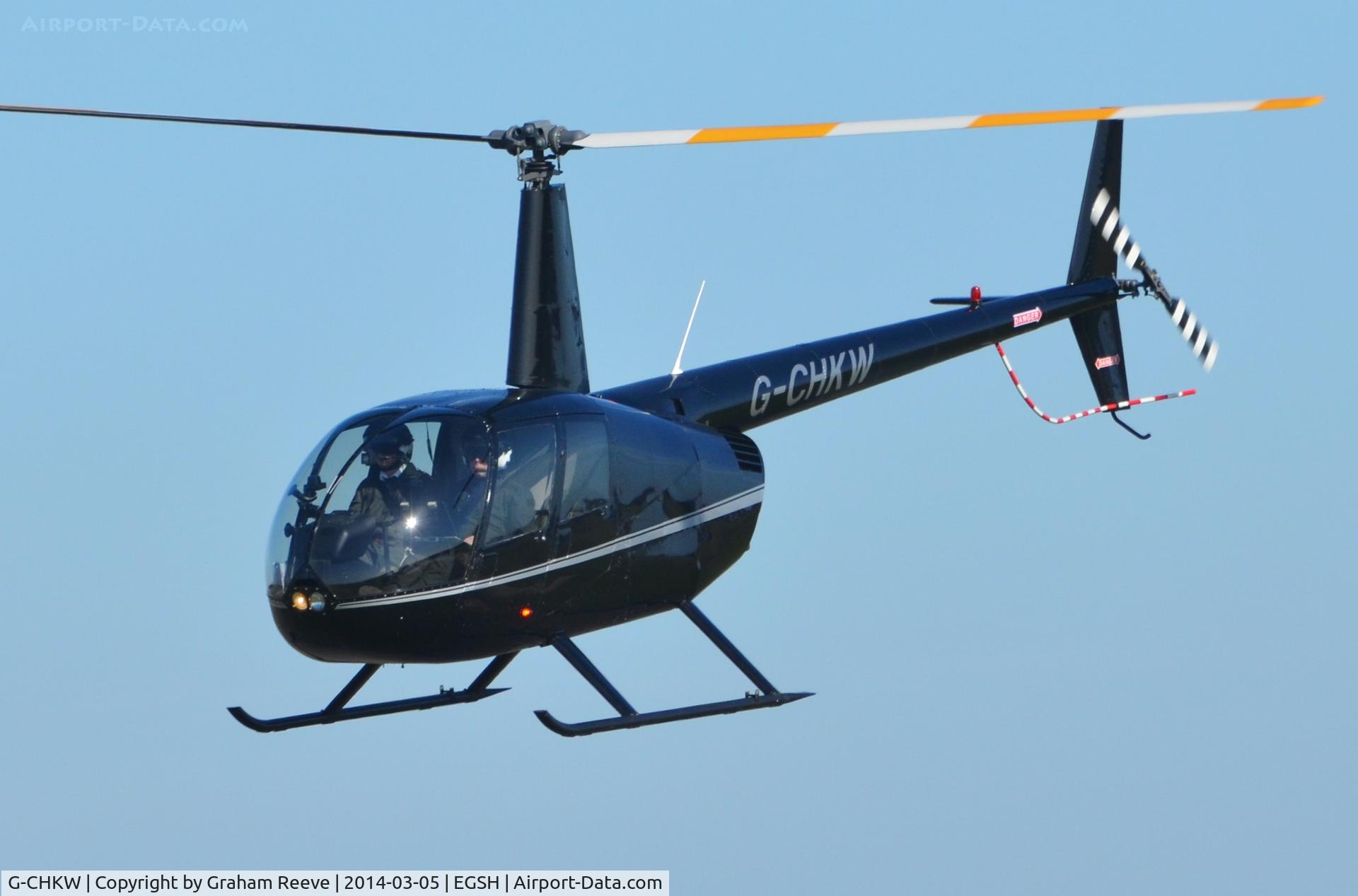 G-CHKW, 2005 Robinson R44 Raven I C/N 1504, Just taken off.