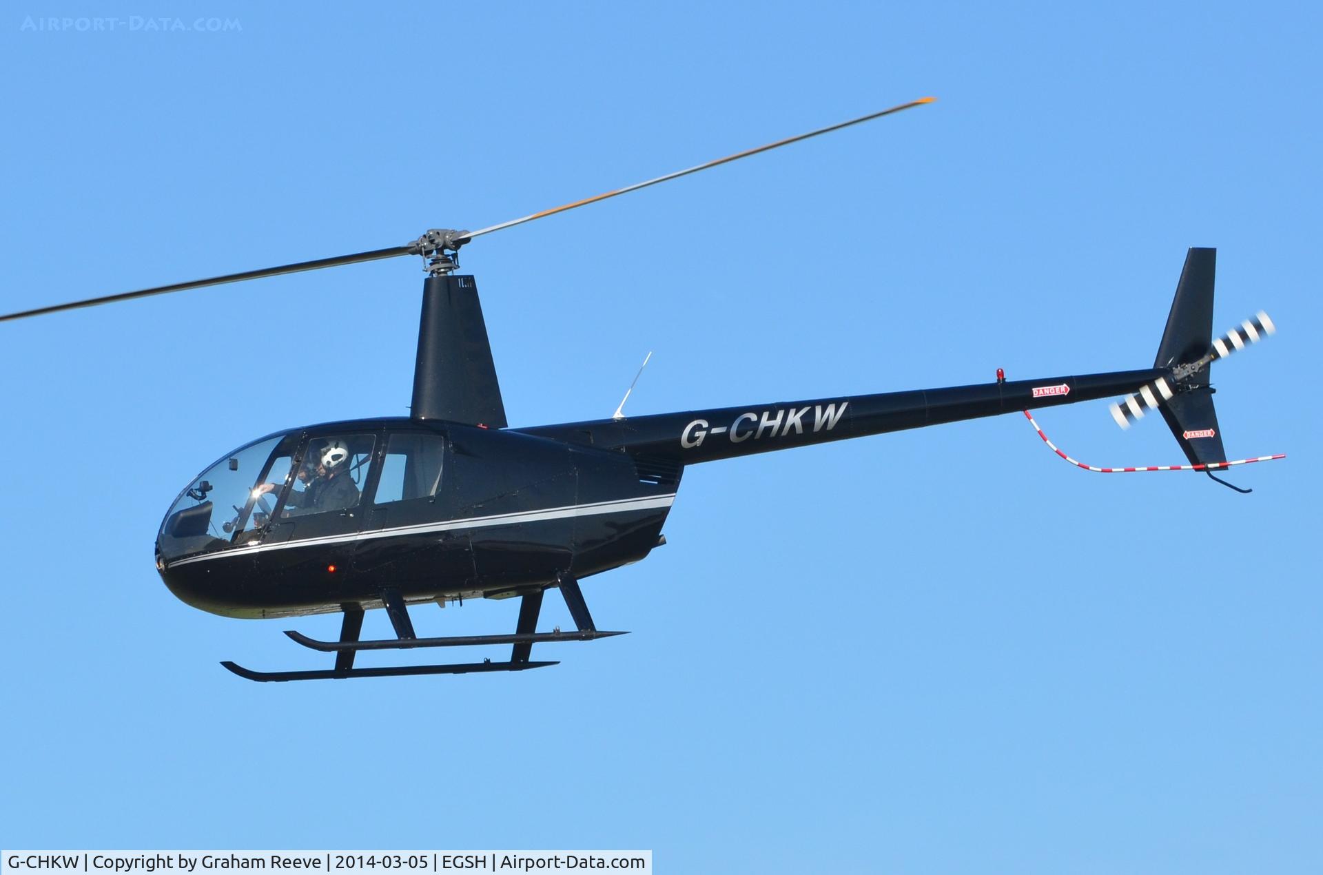 G-CHKW, 2005 Robinson R44 Raven I C/N 1504, Departing from Norwich.
