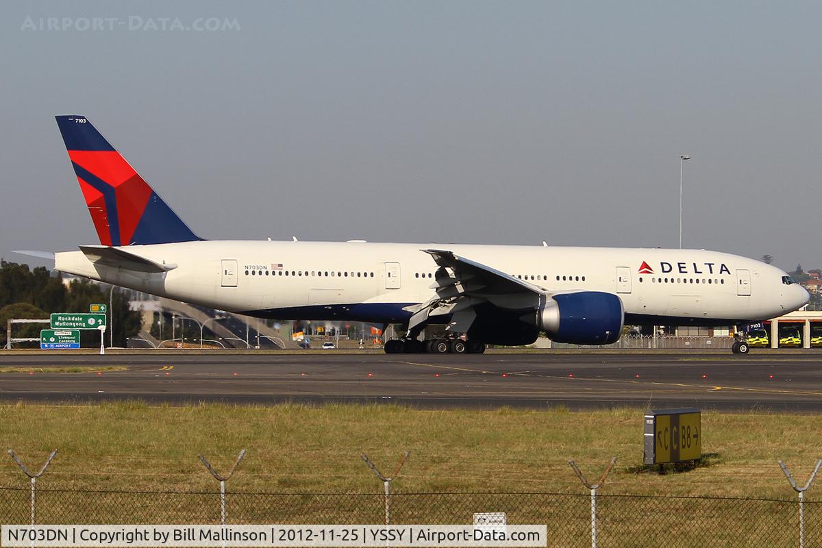 N703DN, 2009 Boeing 777-232/LR C/N 32222, taxiing from 34L