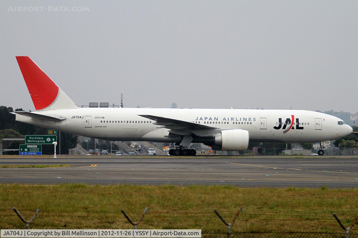 JA704J, 2003 Boeing 777-246/ER C/N 32892, taxi from 34L