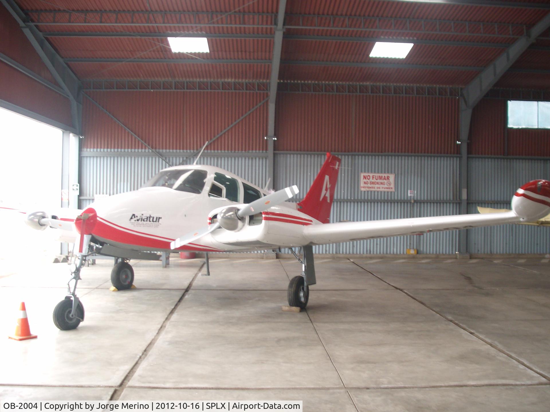 OB-2004, Cessna 310H C/N 310H0055, OB-2004 at the maintenance hangar, Lib Mandi airport (SPLX), Lima, Peru.