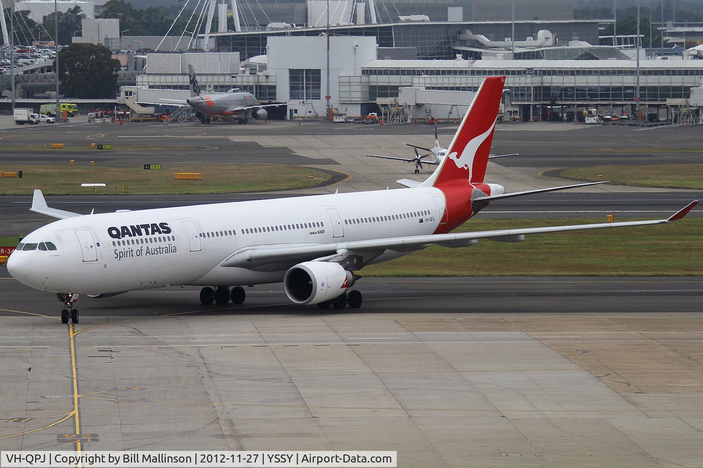 VH-QPJ, 2005 Airbus A330-303 C/N 712, taxiing to gate 10