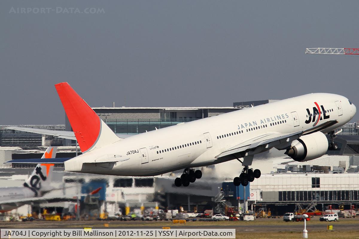 JA704J, 2003 Boeing 777-246/ER C/N 32892, away home to NRT