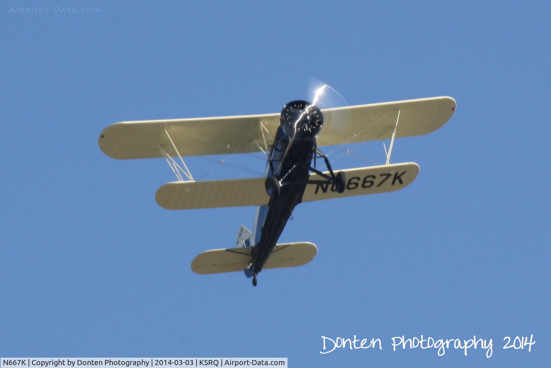 N667K, Stearman 4-E Junior Speedmail C/N 4007, Stearman Junior Speedmail (NC667K) departs Sarasota-Bradenton International Airport following the Airpower History Tour