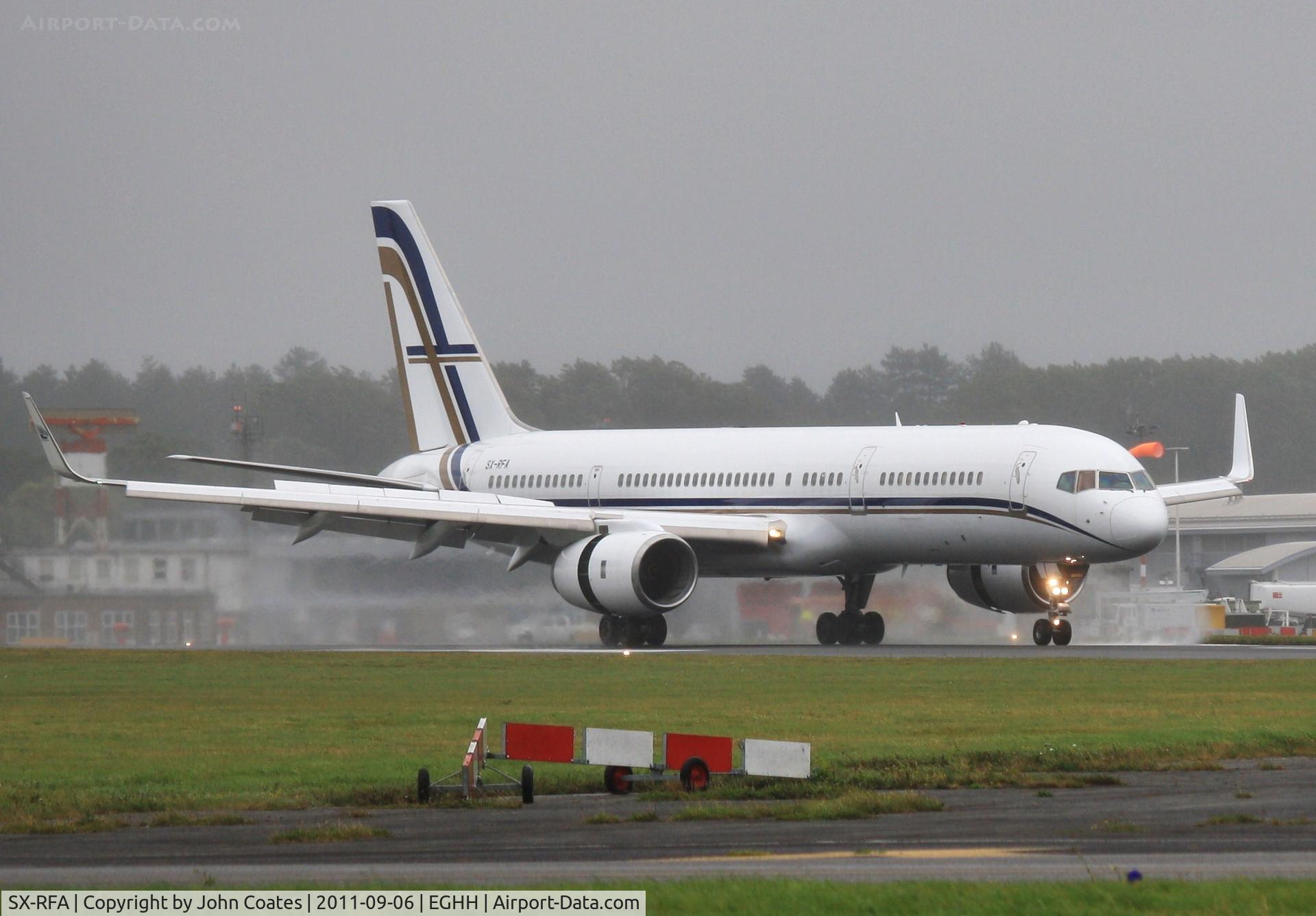 SX-RFA, 1999 Boeing 757-23N C/N 30232, Wet weather arrival