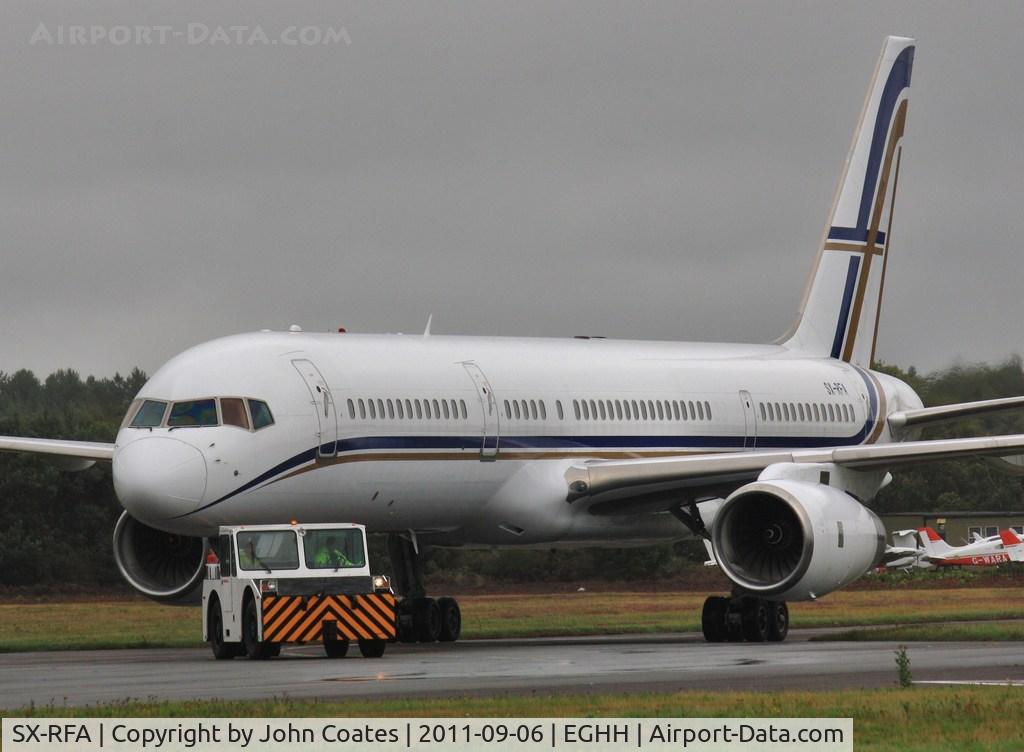 SX-RFA, 1999 Boeing 757-23N C/N 30232, Being towed to European Avn on arrival