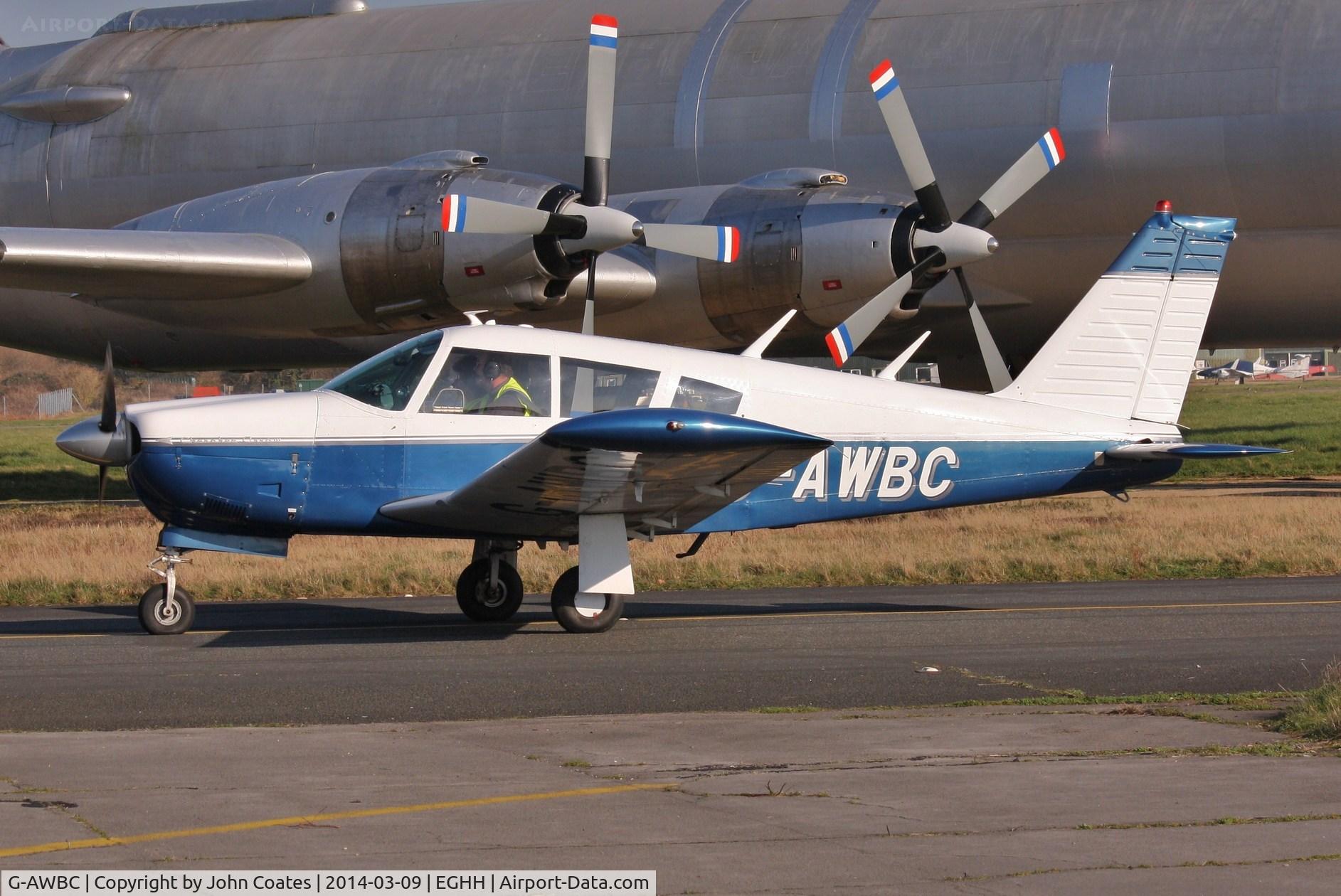 G-AWBC, 1968 Piper PA-28R-180 Cherokee Arrow C/N 28R-30572, Taxiing past the CL44