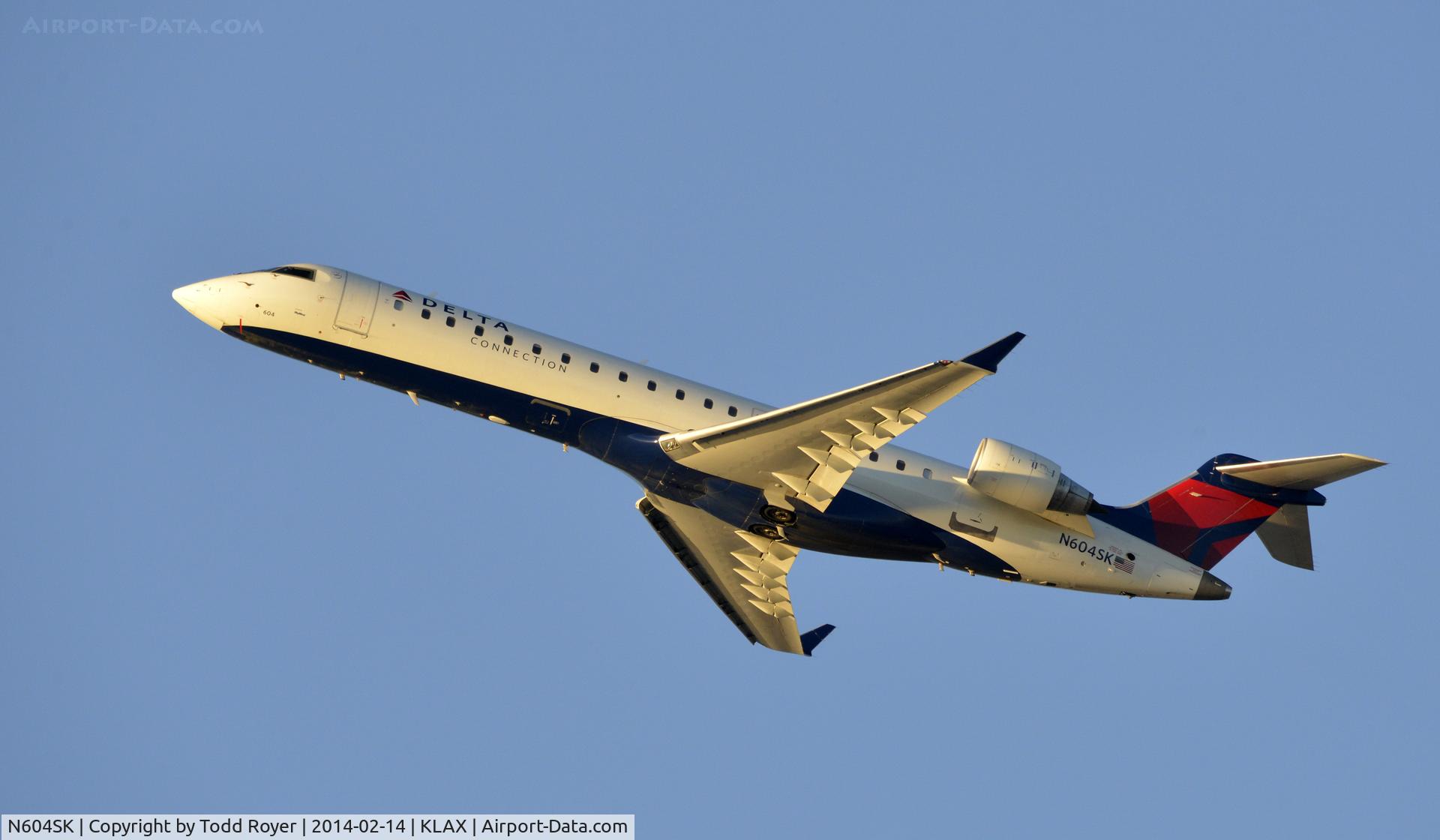 N604SK, 2006 Bombardier CRJ-702 (CL-600-2C10) Regional Jet C/N 10249, Departing LAX on 25R