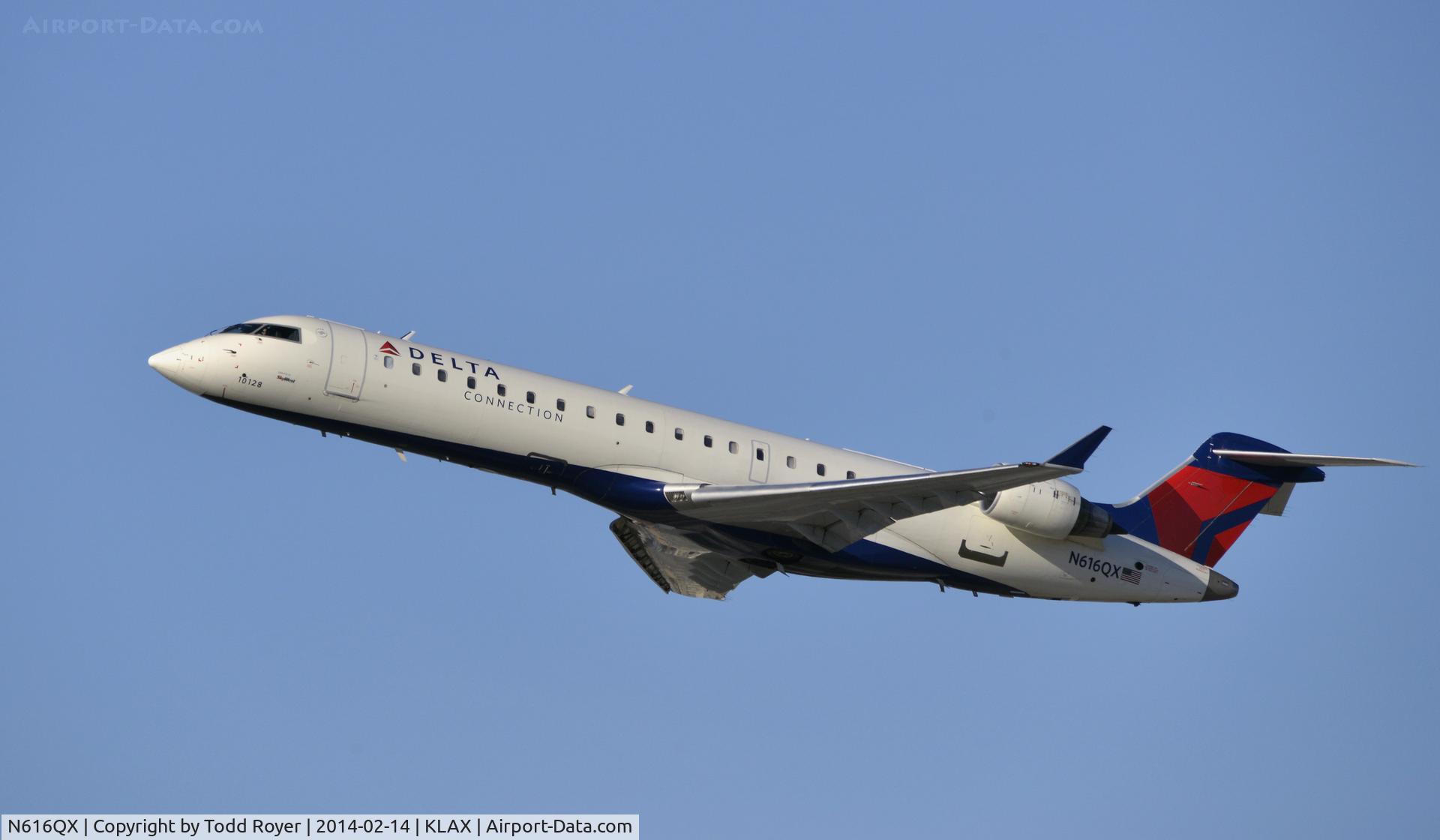 N616QX, 2003 Bombardier CRJ-701 (CL-600-2C10) C/N 10128, Departing LAX on 25R