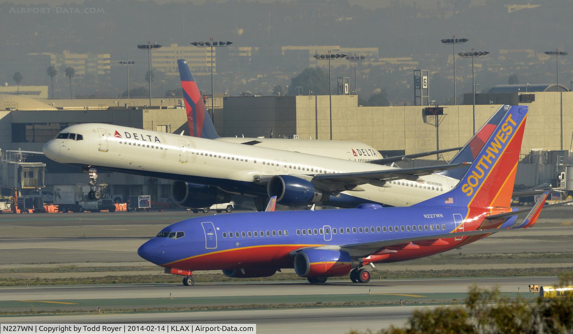 N227WN, 2005 Boeing 737-7H4 C/N 34450, Taxiing to gate at LAX