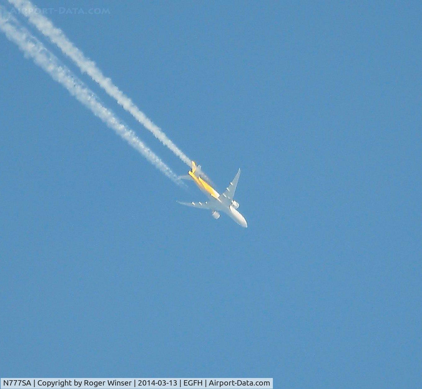 N777SA, 2012 Boeing 777-FZB C/N 37989, B777 operated by Southern Air/DHL Cargo flying east at 35000 feet over Swansea Airport.