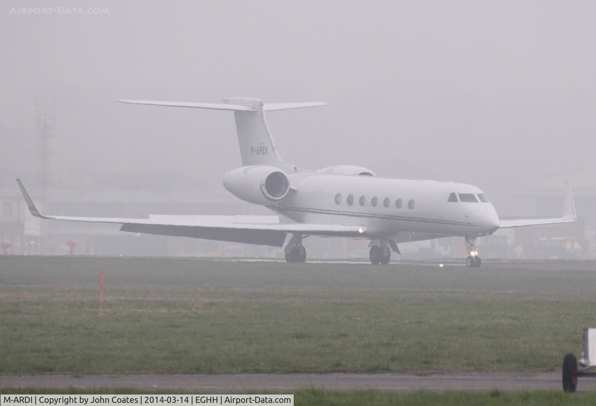 M-ARDI, 2006 Gulfstream Aerospace GV-SP (G550) C/N 5153, Arriving through the fog.