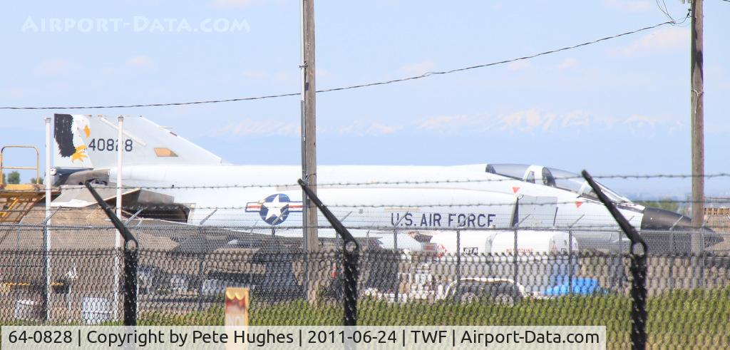 64-0828, 1964 McDonnell F-4C Phantom II C/N 1167, 64-0828 F-4C at Magic Valley Regional, Twin Falls, ID - pity about the fence but at least a record shot to show the continued presence of the Phantom.