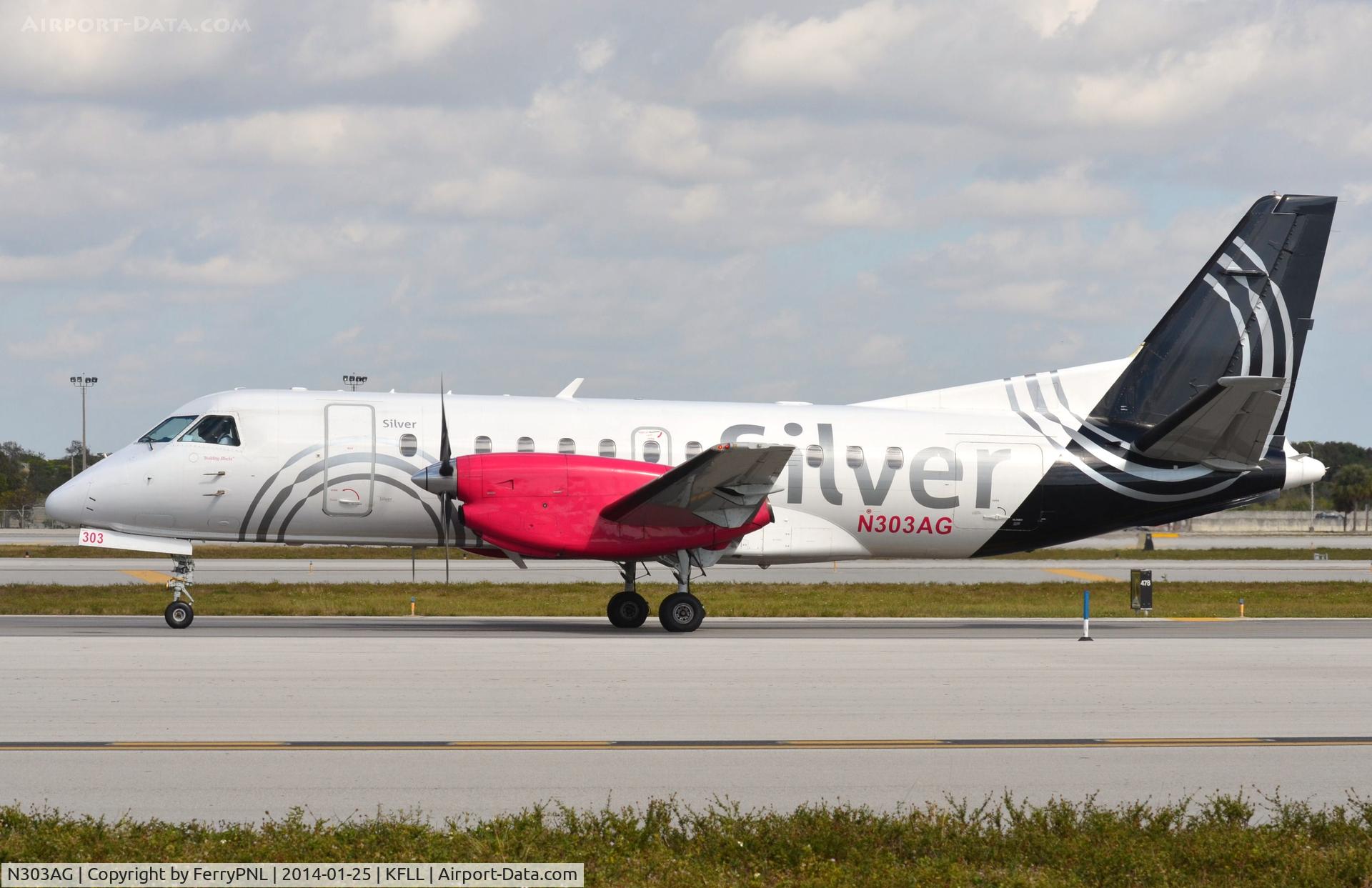 N303AG, 1997 Saab 340B C/N 340B-414, Silver SF340 taxying past.