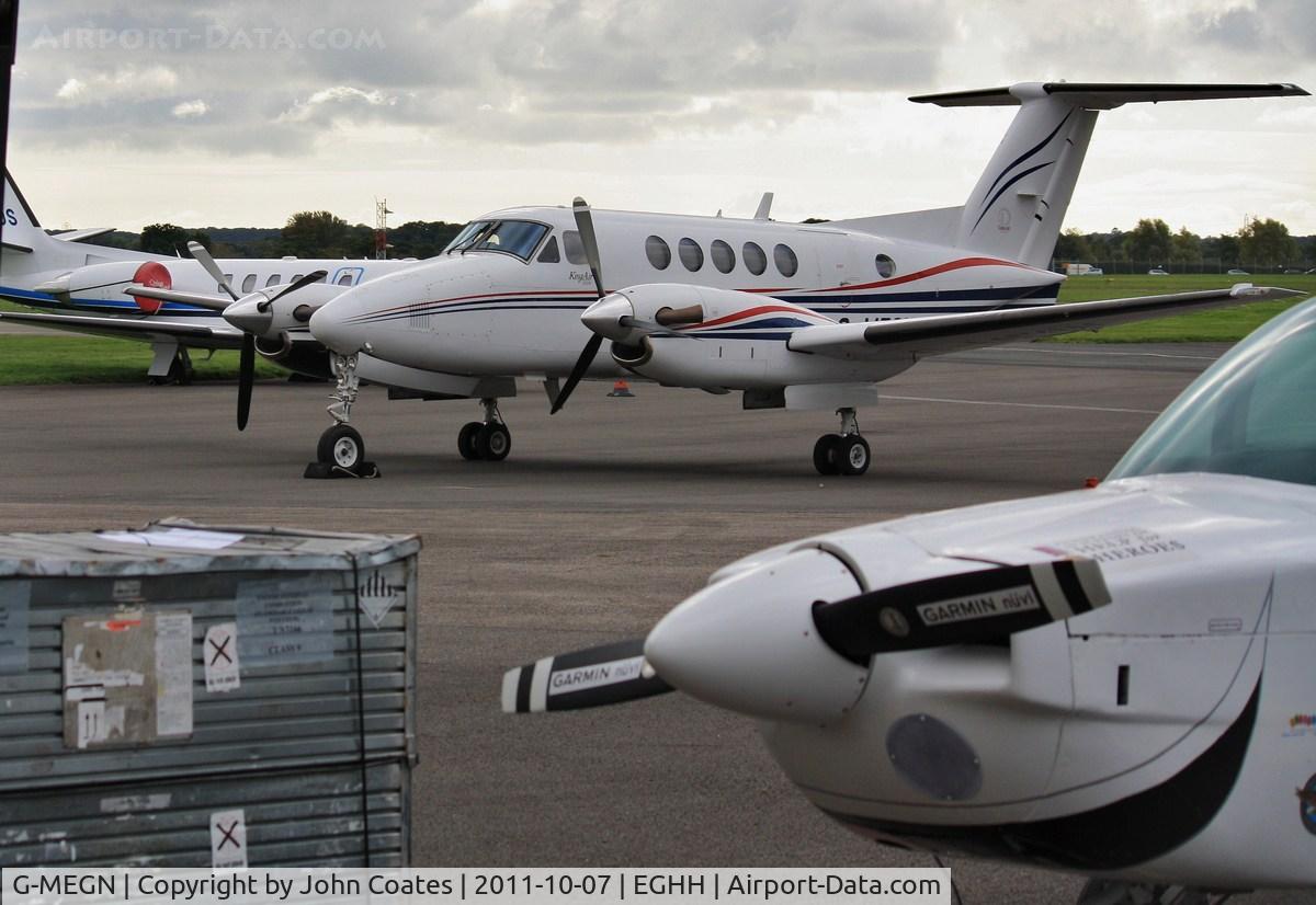 G-MEGN, 1995 Beech B200 Super King Air King Air C/N BB-1518, On a busy Signatures ramp