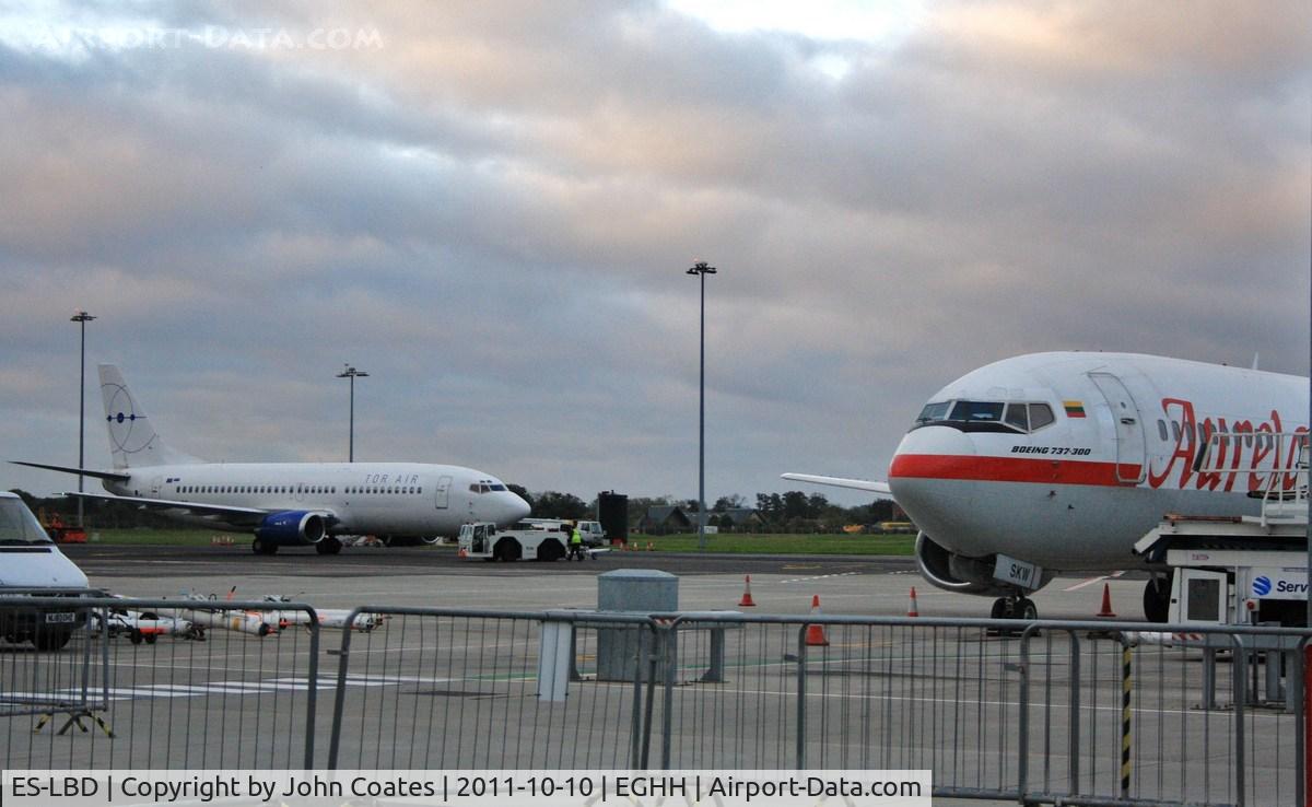 ES-LBD, 1991 Boeing 737-3Q8 SF C/N 25069, On apron with LY-SKW