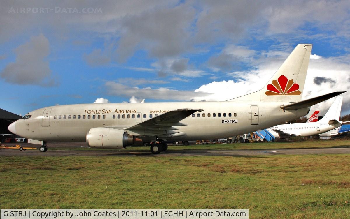 G-STRJ, 1991 Boeing 737-33A C/N 25119, ex XU-TSA arriving at European Avn