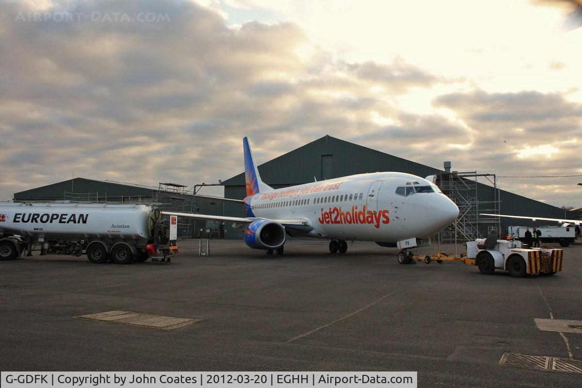 G-GDFK, 1998 Boeing 737-36N C/N 28572, Fuelling up in failing light after repaint