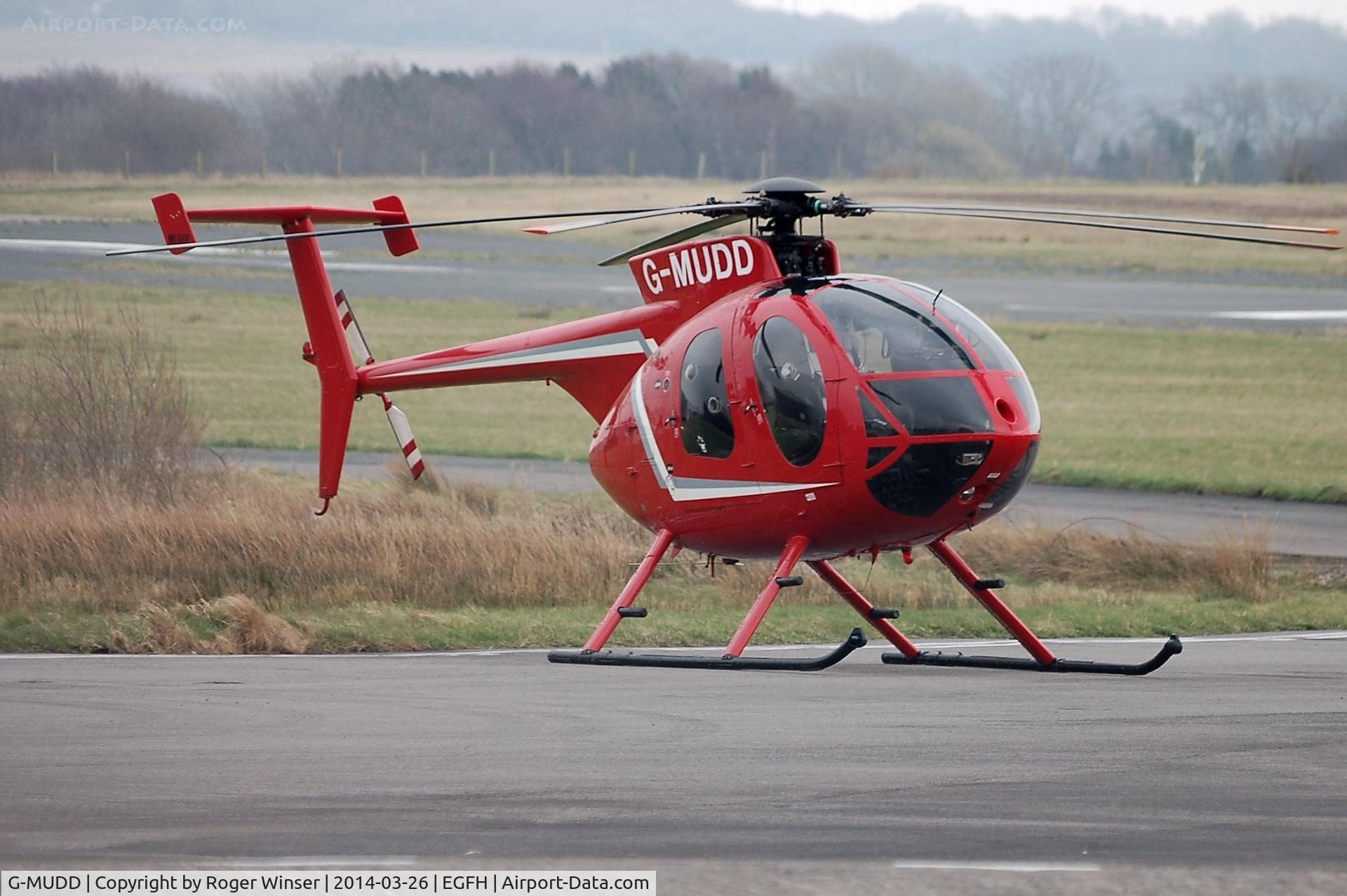 G-MUDD, 1989 Hughes 369E C/N 0325E, Brief visit by a Hughes 500 helicopter. The model 500 was derived from the US military OH-6 Cayuse Light Observation helicopter