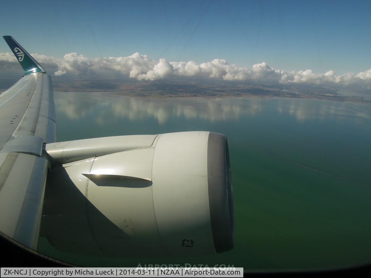 ZK-NCJ, 1995 Boeing 767-319/ER C/N 26915, The clouds mirror in the water of Manuaku Harbour as we climb out of AKL enroute to HNL