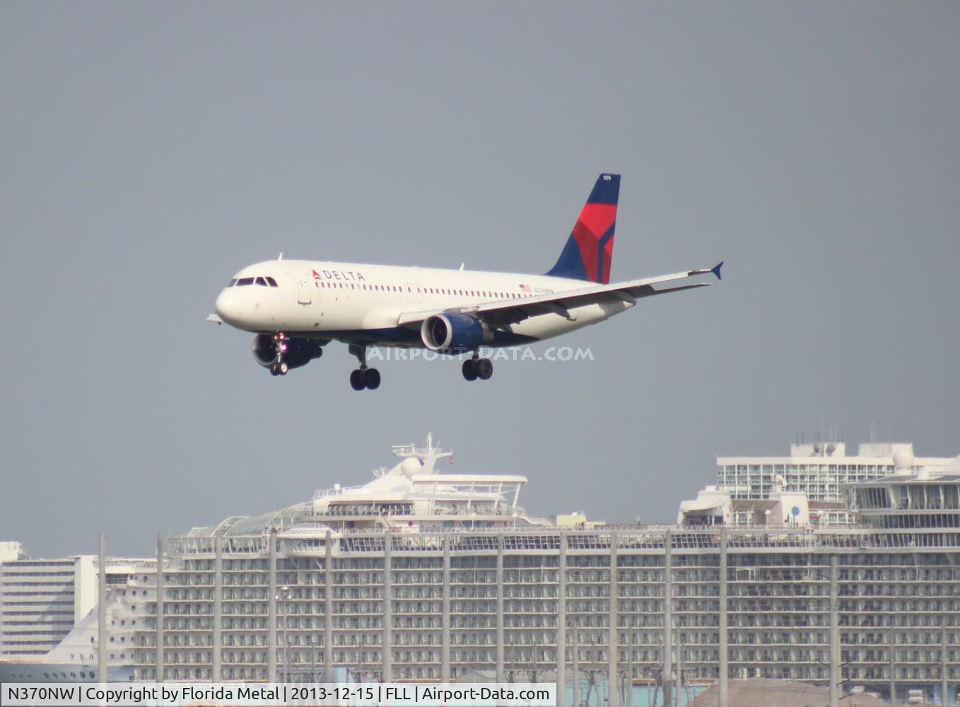 N370NW, 1999 Airbus A320-212 C/N 1037, Delta A320 flying over the Cruise Ships at Port Everglades