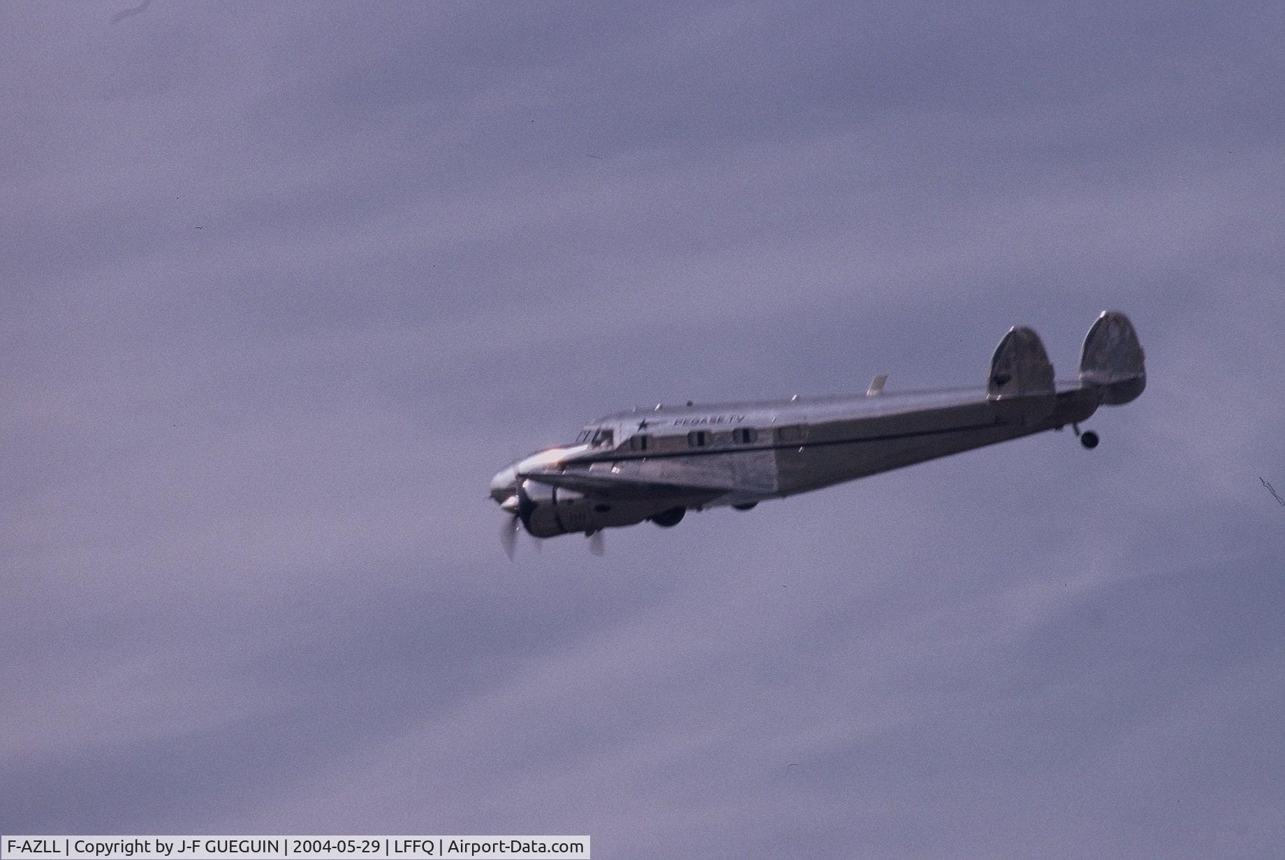 F-AZLL, 1941 Lockheed 12A Electra Junior C/N 1287, In flight at La Ferté-Alais, 2004 airshow.