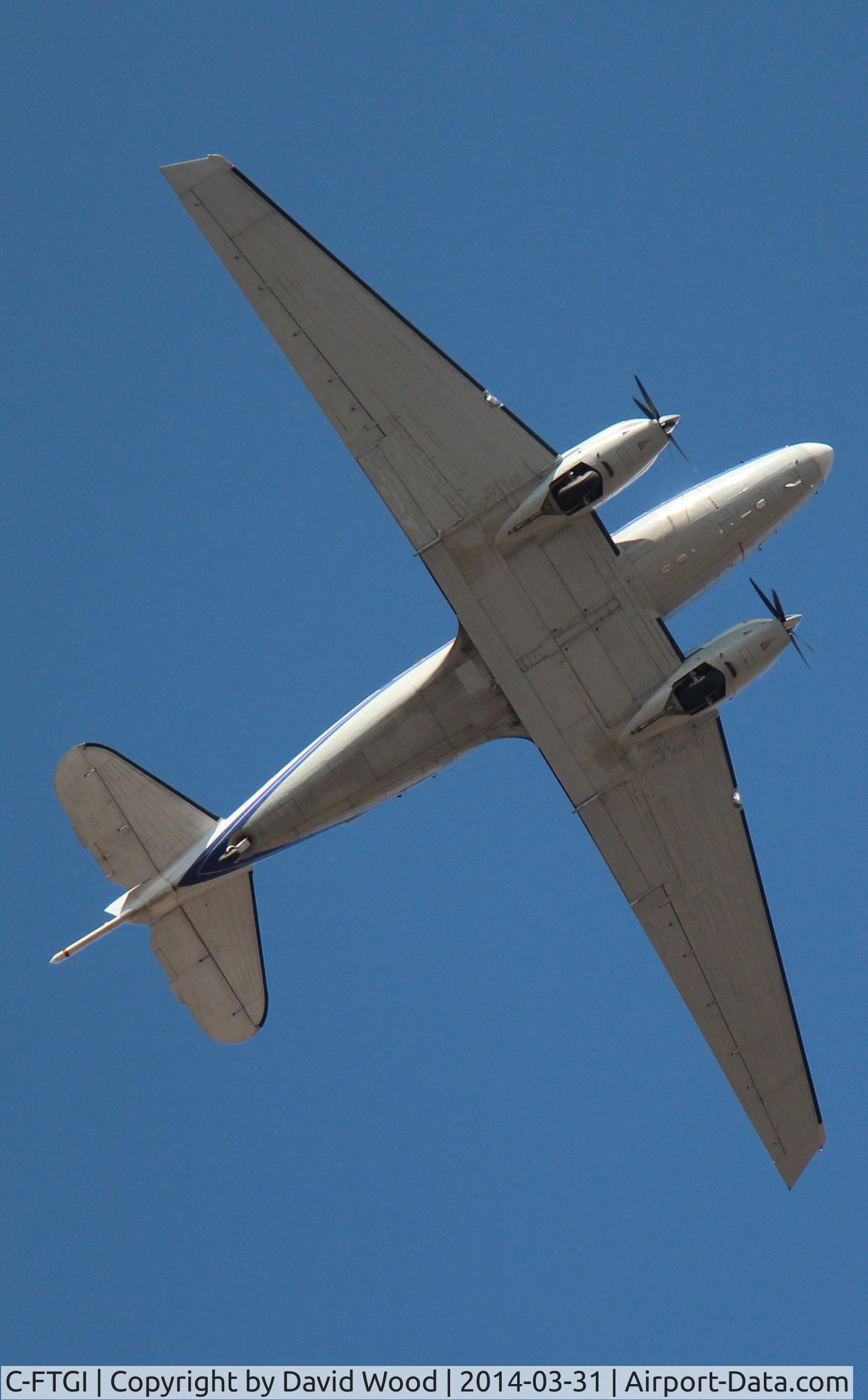 C-FTGI, 1944 Basler BT-67 C/N 26268, First pass overhead, second pass I was able to photograph the registration #