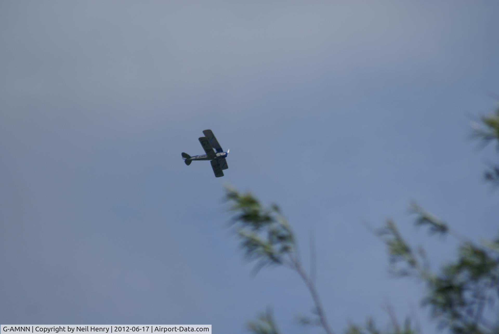 G-AMNN, 1944 De Havilland DH-82A Tiger Moth II C/N 86457, flying over Arundel, West Sussex, UK