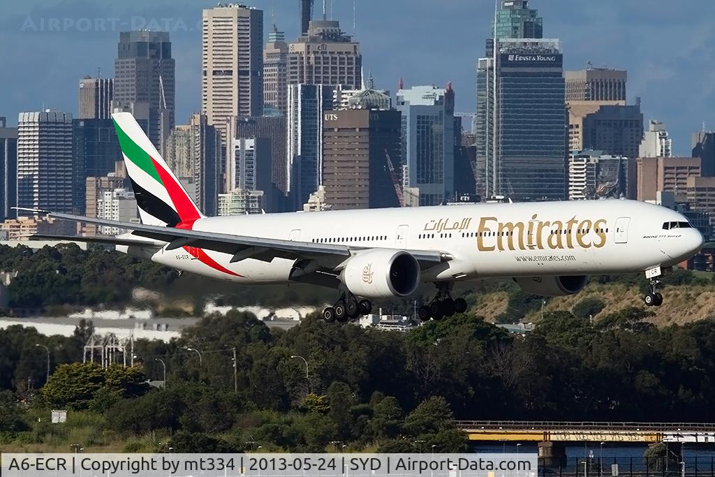 A6-ECR, 2009 Boeing 777-31H/ER C/N 35592, Emirates B777-300 on approach to Sydney with the city skyline in the bakground