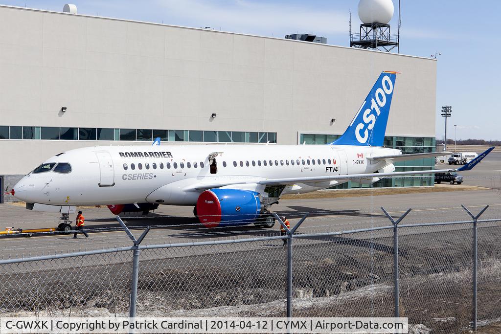 C-GWXK, 2013 Bombardier CSeries CS100 (BD-500-1A10) C/N 50004, Bombardier CSeries newest test bird FTV4 towed back into the hanger after having been outside on this beautiful spring day.
