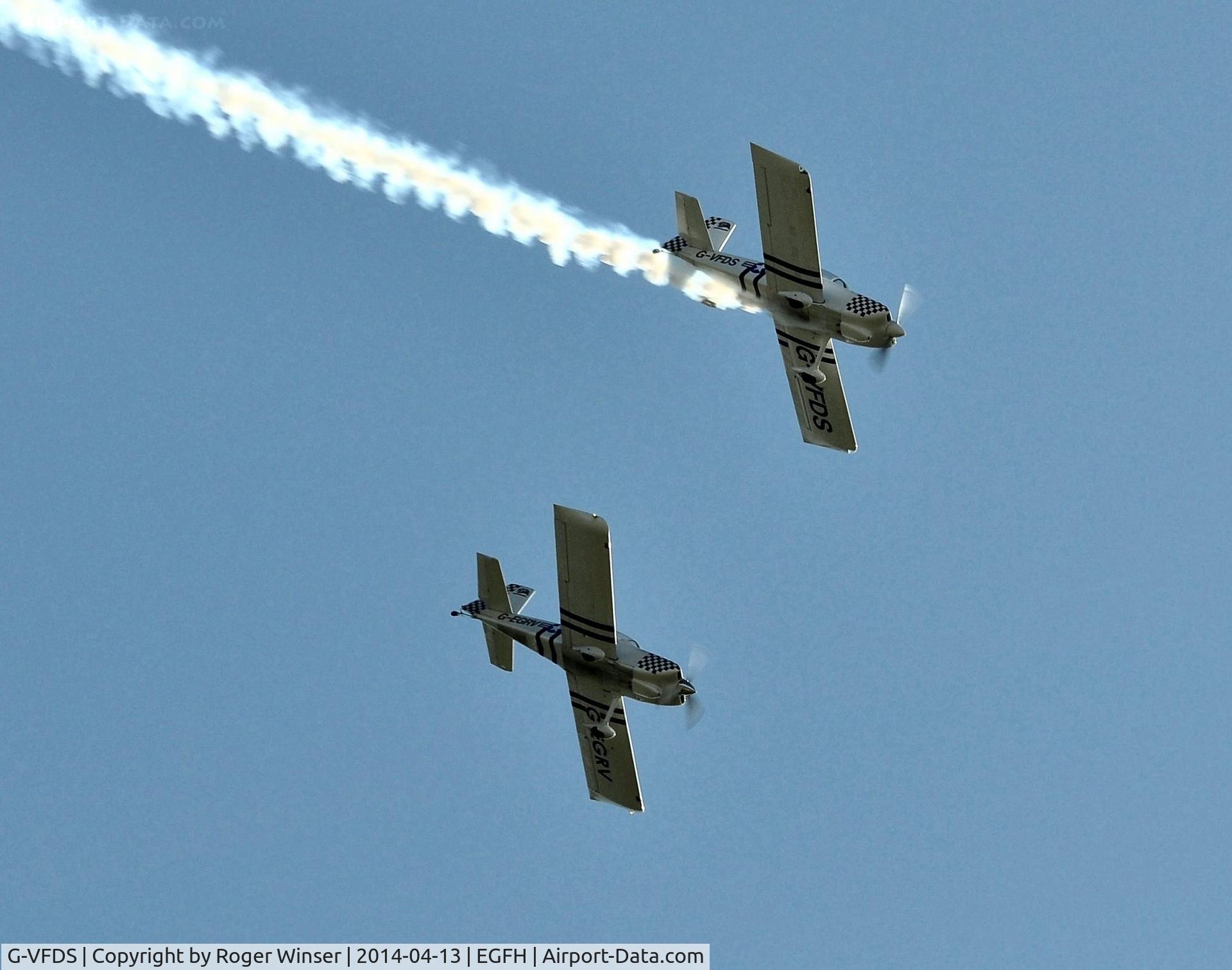G-VFDS, 2012 Vans RV-8 C/N PFA 303-14637, With smoke on leading G-EGRV. In Team Raven formation aerobatic display team markings.