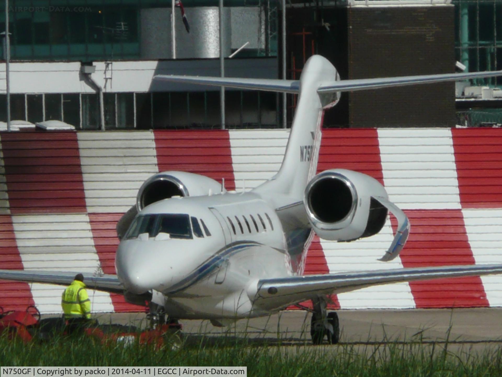 N750GF, 2005 Cessna 750 Citation X C/N 750-0244, on the ocs ramp being towed back into the hanger
