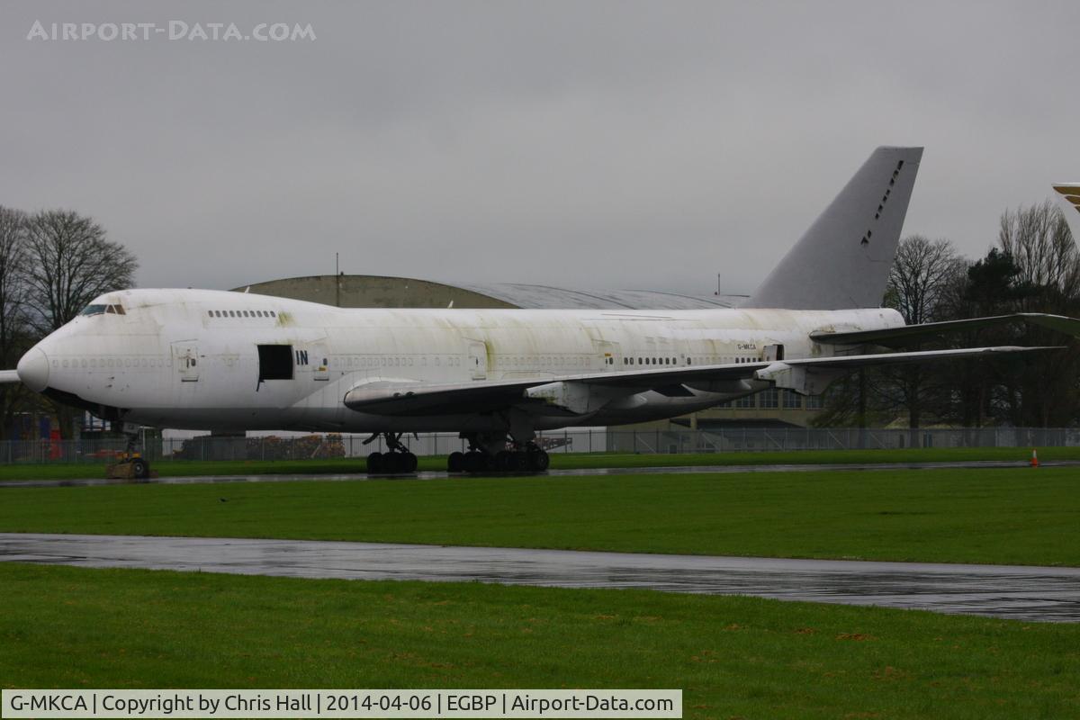 G-MKCA, 1980 Boeing 747-2B5B/SF C/N 22482, with the MK titles removed, the large hole in the side and infront of the nose wheel were made for a media event by Land Rover during which a 2014 Range Rover Sport drove round an obstacle course inside the aircraft.