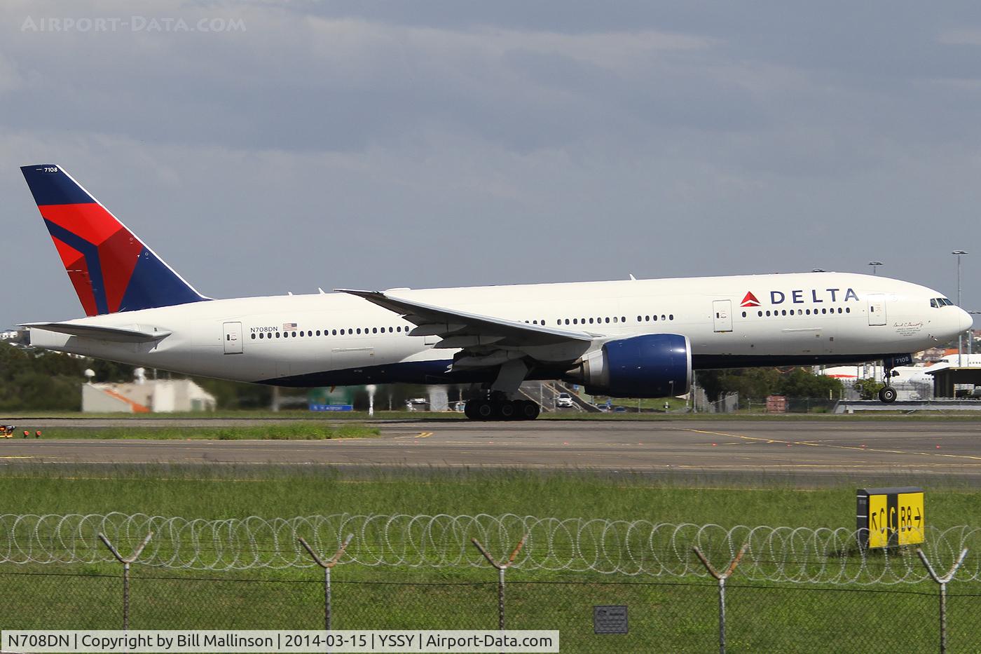 N708DN, 2009 Boeing 777-232/LR C/N 39254, rotating from 34L