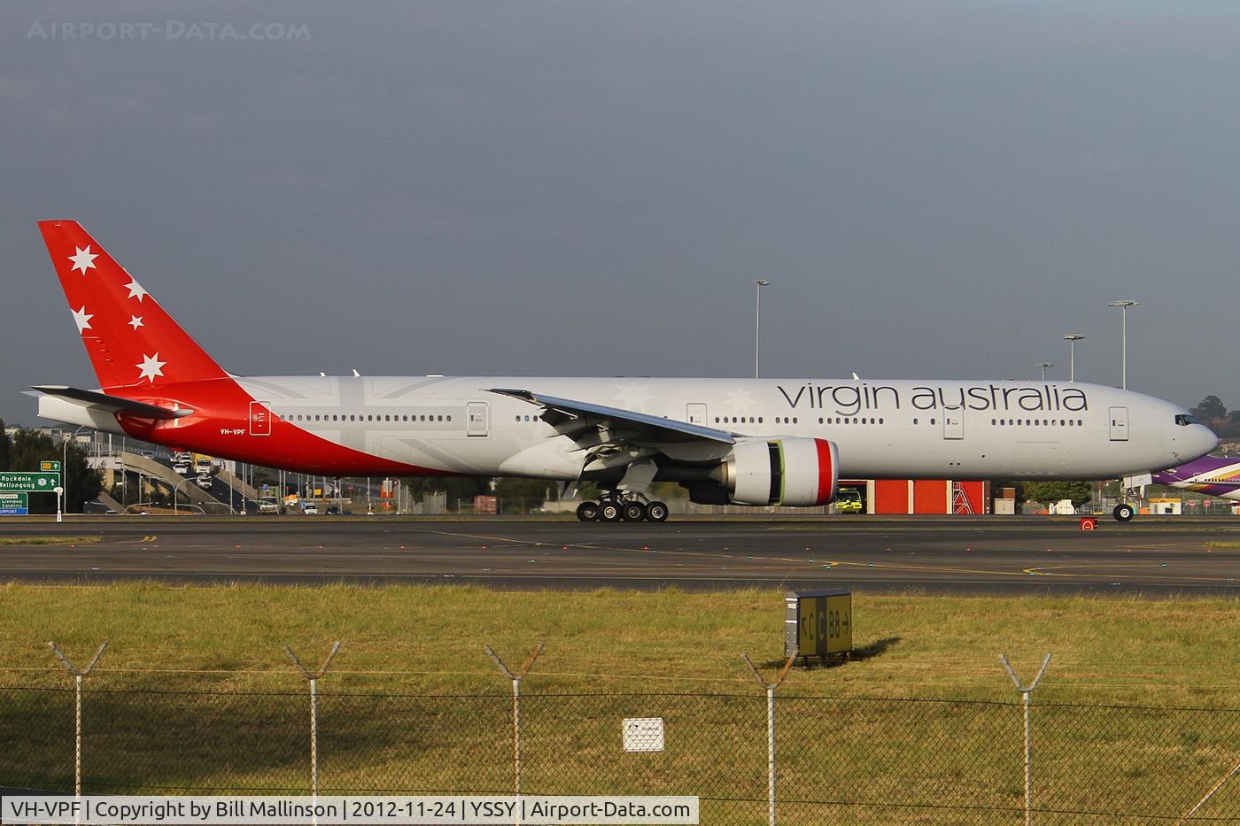 VH-VPF, 2009 Boeing 777-3ZG/ER C/N 37940, just down onto 34L