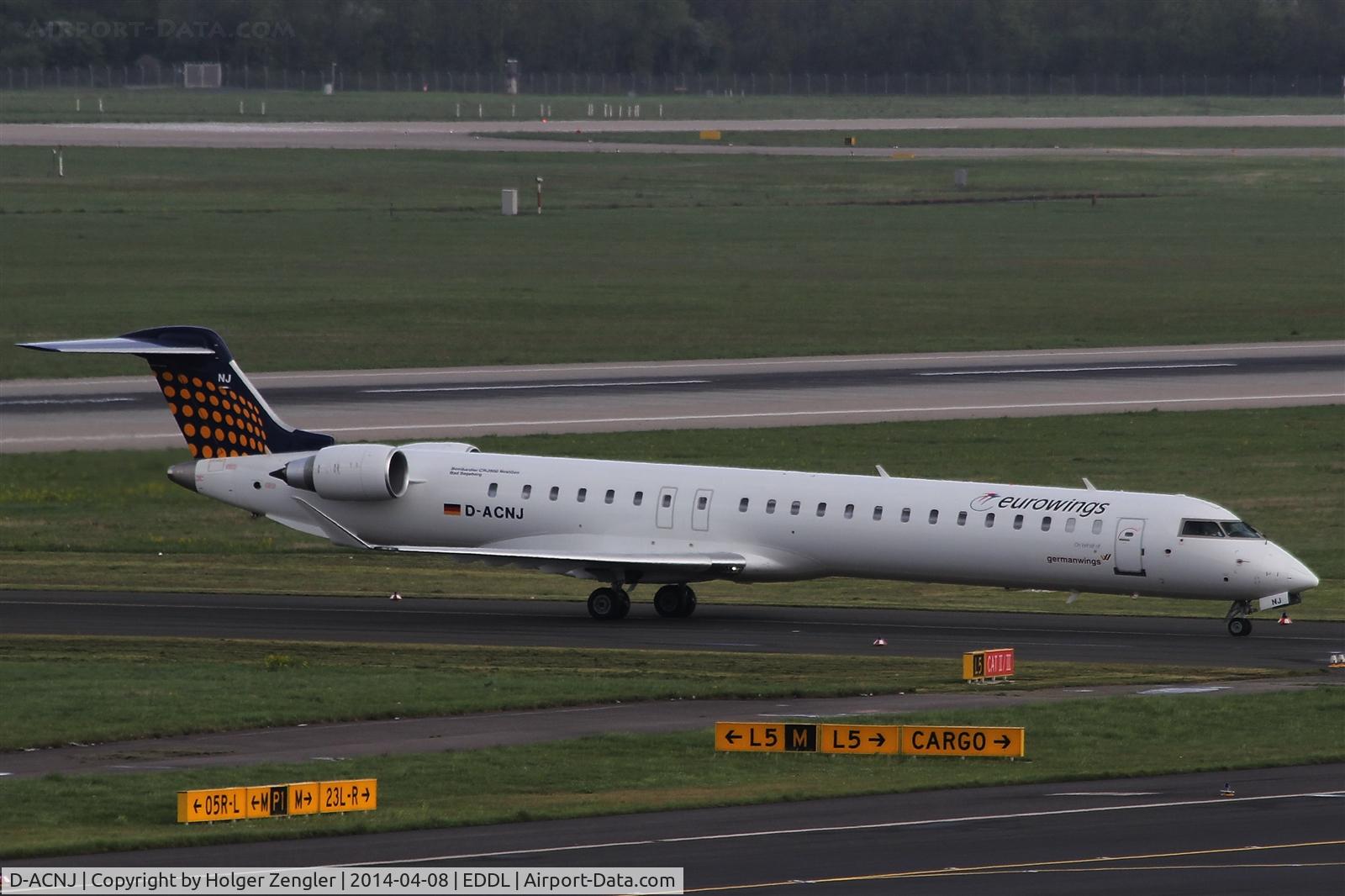 D-ACNJ, 2010 Bombardier CRJ-900 NG (CL-600-2D24) C/N 15249, Leaving rwy 23L on its way to parking position...