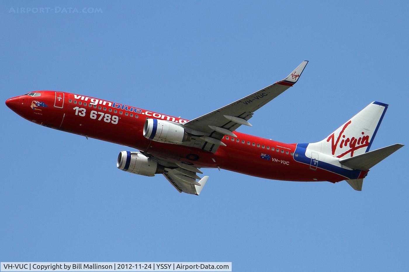 VH-VUC, 2004 Boeing 737-8FE C/N 34014, climbing from 34L