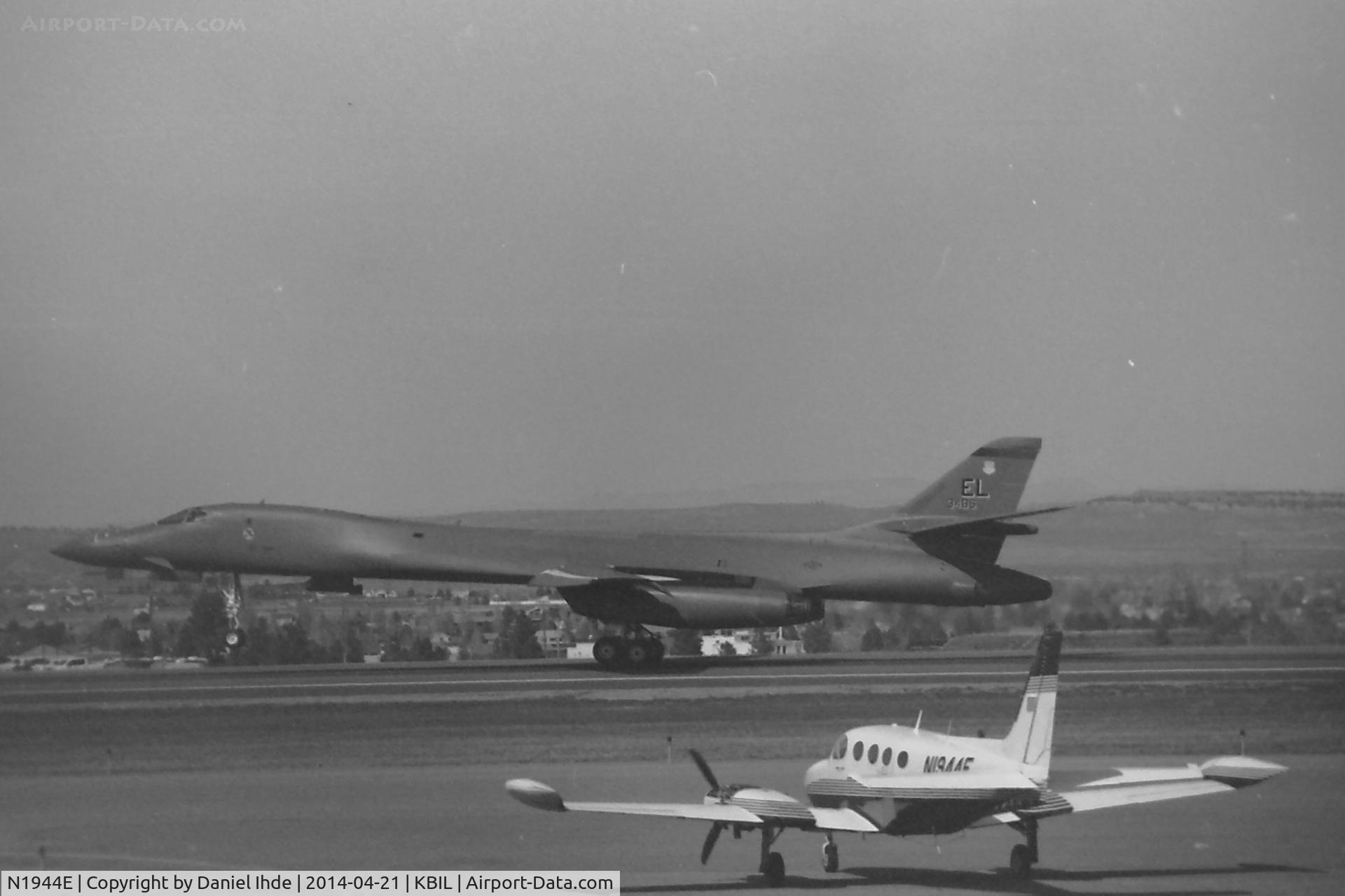 N1944E, 1946 Champion 7AC C/N 7AC-5511, Cessna 340 is ID'd in foreground.  If anyone can help with a positive aircraft ID on the B-1 landing, Ill be happy to post a better photo of it.  Film photo - Kodak Plus-X, expired 2003 (Kodak D-76 developer) along with a 1950's lens